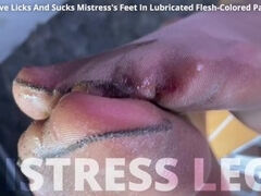 Foot slave licks and sucks Mistress's feet in lubricated flesh-colored pantyhose