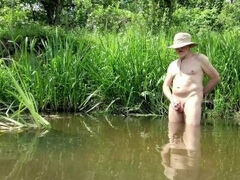 I walk nude in a small river, then play with myself, suddenly I see a drone