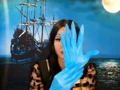 Glove fetish. Dominatrix Nika puts on medical gloves and tears them with long nails